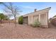 Backyard with covered patio and gravel landscaping at 3218 Squire St, Las Vegas, NV 89135