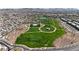 Aerial view of a lush green park with walking paths and community amenities at 377 Silva Pl, Henderson, NV 89011