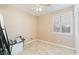 Bedroom with ceiling fan, tile flooring, and large window at 5372 Polo Grounds St, Las Vegas, NV 89148