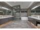 Modern bathroom with double sinks and a large glass shower at 673 Falcon Cliff Ct, Henderson, NV 89012