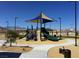 Modern playground with shade structure and slides at 7506 Fort Mcdermitt Ave, Las Vegas, NV 89179