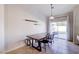 Bright dining area with wooden table and sliding glass doors at 812 Cowboy Cross Ave, North Las Vegas, NV 89081