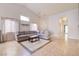 Open concept living area with tile flooring and sectional sofa at 812 Cowboy Cross Ave, North Las Vegas, NV 89081