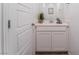 Small bathroom with white vanity and light wood-like flooring at 8831 Sasquatch Run Ave, Las Vegas, NV 89166