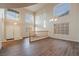 Bright living room with high ceilings, wood floors, and large windows at 932 Sweeping Vine Ave, Las Vegas, NV 89183