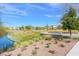 Lakefront park with tiered seating, walking paths, and lush landscaping at 120 Cabaletta Ln, Henderson, NV 89015