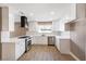 Modern white kitchen with gold hardware, stainless steel appliances, and ample counter space at 120 Steeler Dr, Las Vegas, NV 89145