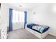 Bright bedroom with a twin-size bed and blue accents at 164 Herbie Ln, Henderson, NV 89015