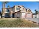 Two-story house with three-car garage and landscaped yard at 164 Herbie Ln, Henderson, NV 89015