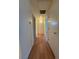 Hallway with wood-look flooring and doors leading to various rooms at 2041 Hussium Hills St # 108, Las Vegas, NV 89108