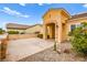 Front view of house with a walkway, landscaping, and a cactus at 2132 Idaho Falls Dr, Henderson, NV 89044