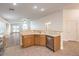 Kitchen with island, stainless steel appliances, and light wood cabinets at 2287 Dakota Sky Ct, Henderson, NV 89052