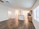 Living room features wood-look flooring and an open floor plan at 2287 Dakota Sky Ct, Henderson, NV 89052