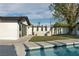 Relaxing pool area, featuring a concrete patio and grassy lawn at 3575 Tioga Way, Las Vegas, NV 89169