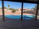 Pool with spa, covered patio, and surrounding houses at 4454 Bertram Ln, Las Vegas, NV 89147