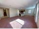 Spacious open living area with kitchen, dining, and view of staircase at 5358 Panaca Spring St, Las Vegas, NV 89122