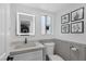 Modern bathroom with a sleek vanity, updated fixtures, and decorative wall art at 657 Glenwood Ln, Henderson, NV 89002