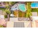 Aerial view showing a house with a large backyard, pool, and playground at 6585 Coronado Crest Ave, Las Vegas, NV 89139