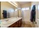 Bathroom with double vanity and a bathtub at 6585 Coronado Crest Ave, Las Vegas, NV 89139