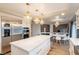 White kitchen with island and breakfast nook at 6585 Coronado Crest Ave, Las Vegas, NV 89139