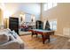 Living room with a pool table and fireplace at 6585 Coronado Crest Ave, Las Vegas, NV 89139