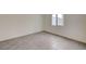 Unfurnished bedroom with tile flooring and a window at 6767 Warthog Ave, Las Vegas, NV 89156