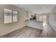 Modern kitchen with white cabinets, stainless steel appliances, and a breakfast bar at 6767 Warthog Ave, Las Vegas, NV 89156