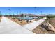 Paved walkways and landscaping around a community basketball court and playground at 7615 Phoenix Falls St # Lot 46, North Las Vegas, NV 89084