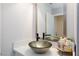 Stylish bathroom featuring a modern vessel sink, white countertop, and a large mirror at 7970 Counterpoint Ln, Las Vegas, NV 89123