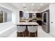 Updated kitchen featuring dark wood cabinetry, stainless steel appliances, and ample counter space at 7970 Counterpoint Ln, Las Vegas, NV 89123