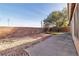 Small backyard with a patio and gravel landscaping at 918 Ambusher St, Henderson, NV 89014