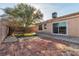 Backyard with a patio, grass, and a tree at 918 Ambusher St, Henderson, NV 89014