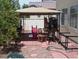 Backyard with covered patio, play area, and some landscaping at 10383 Gwynns Falls St, Las Vegas, NV 89183