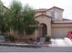 Two-story home with attached garage and landscaped front yard at 10383 Gwynns Falls St, Las Vegas, NV 89183