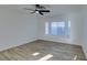 Spacious bedroom with wood-look floors and a bay window at 1100 Maserati Dr, Las Vegas, NV 89117