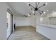 Open living room with hardwood floors and modern lighting at 1100 Maserati Dr, Las Vegas, NV 89117