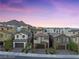 Townhouse community with mountain views at sunset at 11820 Pelican Butte Ave, Las Vegas, NV 89138