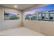 Empty balcony with a view of other townhomes at dusk at 11820 Pelican Butte Ave, Las Vegas, NV 89138