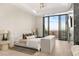 Luxurious main bedroom with city views, fireplace, and private balcony at 1491 Reims Dr, Henderson, NV 89012