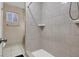 Clean bathroom with a shower stall and tiled walls at 1720 Sweeney Ave, Las Vegas, NV 89104