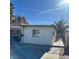 House exterior featuring a gated entry and a paved driveway at 1720 Sweeney Ave, Las Vegas, NV 89104