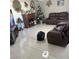 Living room with a fireplace, tiled floor, and leather furniture at 1720 Sweeney Ave, Las Vegas, NV 89104