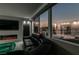 Living room features a sectional sofa, fireplace, and city views at dusk at 205 E Harmon Ave # 1012, Las Vegas, NV 89169