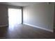 Living room with wood-look floors and sliding glass doors at 3550 Bay Sands Dr # 2045, Laughlin, NV 89029