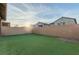 Private backyard with artificial turf and sunset view at 361 Andy Wheeler Dr, Henderson, NV 89011