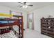 ' bedroom with bunk beds, dresser, and ceiling fan at 361 Andy Wheeler Dr, Henderson, NV 89011