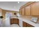 Kitchen with oak cabinets and a view of the backyard at 3617 Hammerkop Dr, North Las Vegas, NV 89084