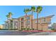 Two-story building with palm trees and parking at 7151 S Durango Dr # 214, Las Vegas, NV 89113