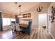 Elegant dining area with a farmhouse table and modern chandelier at 8653 Prairie Hill Dr, Las Vegas, NV 89134