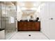 Elegant bathroom with double sinks, a large mirror, and a walk-in shower at 145 E Harmon Ave # 606, Las Vegas, NV 89109